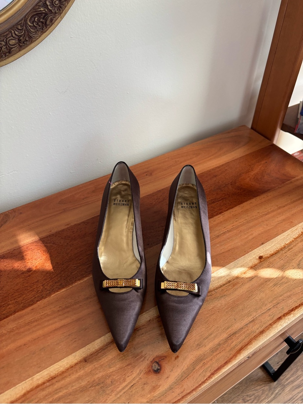 Stuart Weitzman Chocolate Brown Pointed Toe Bow Pumps with Gold Accent